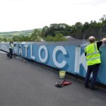 Volunteers on the eastern section of the Matlock Mural. Brian Ford and Helen Crane in foreground.