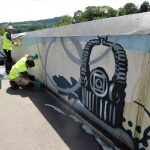 Stained wall with cleaning in progress - Tony Symes and Phil Smith