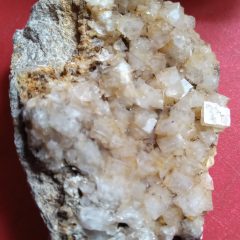 Colourless cubes of Fluorspar (CaF2). Fluorspar is used as a raw material to make hydrofluoric acid and hence fluorocarbons for non-stick polymers, etc. It is also used in metallurgy, ceramics and optics.